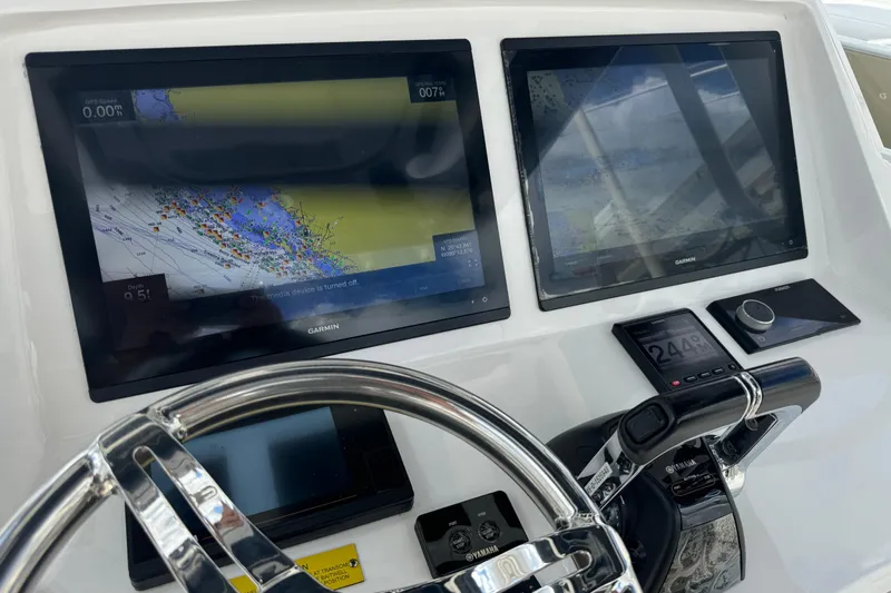  Yacht Photos Pics Control panel of a 2019 Intrepid 345 Nomad FE with Garmin navigation displays.