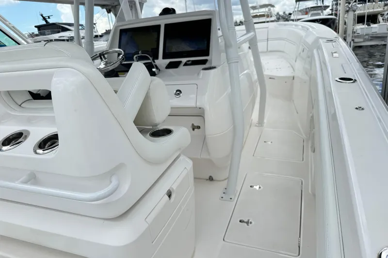  Yacht Photos Pics 2019 Intrepid 345 Nomad FE boat interior with helm and seating area.