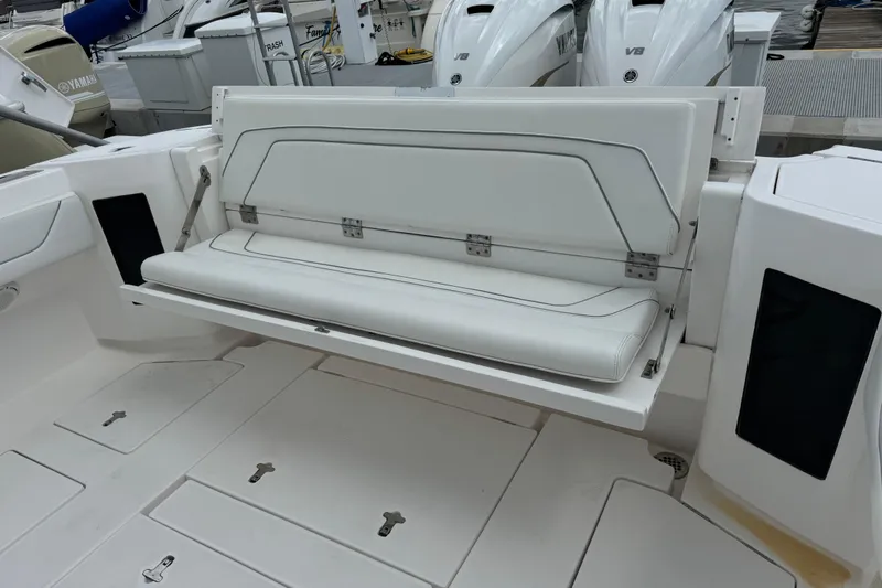  Yacht Photos Pics 2019 Intrepid 345 Nomad FE boat with foldable white bench seat.