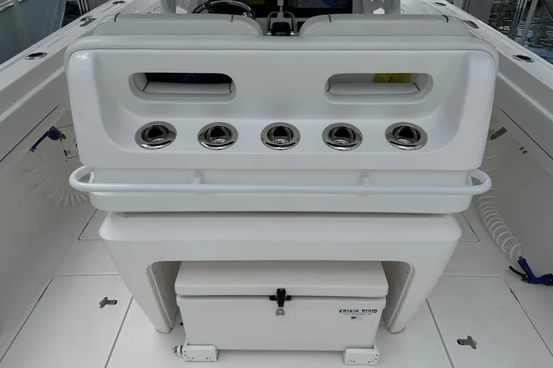  Yacht Photos Pics 2019 Intrepid 345 Nomad FE boat interior with rod holders and storage compartment.