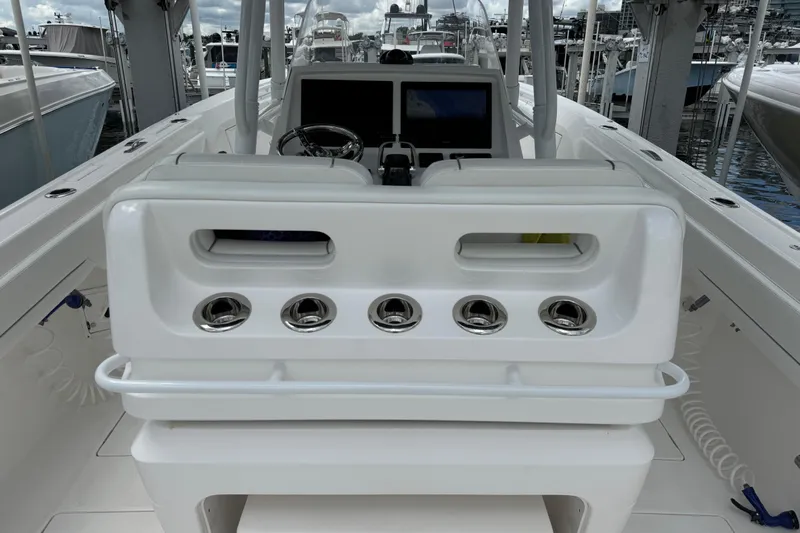  Yacht Photos Pics 2019 Intrepid 345 Nomad FE boat interior with helm and seating area.