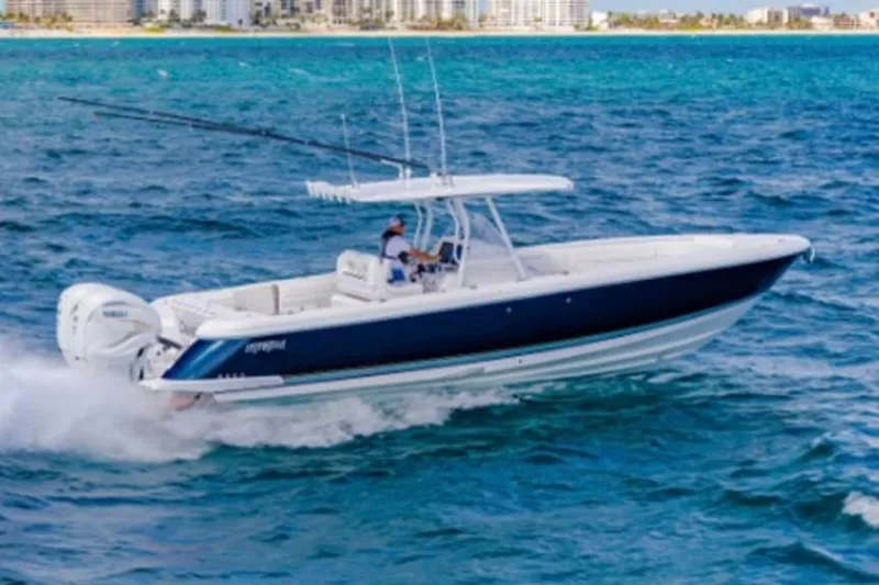  Yacht Photos Pics 2019 Intrepid 345 Nomad FE boat cruising on blue ocean waters.