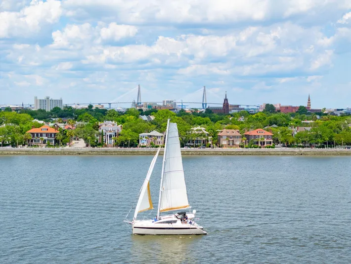 La Cura Yacht Photos Pics Sailboat on river with cityscape and bridge in background, Privilege Series 5, 2015.