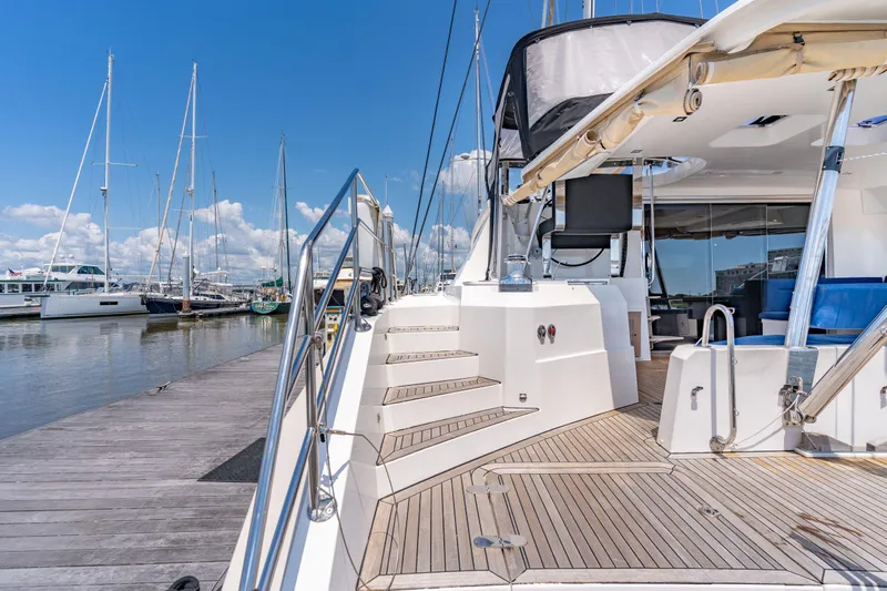 La Cura Yacht Photos Pics Luxury Privilege Series 5 yacht docked at marina, showcasing elegant deck design.