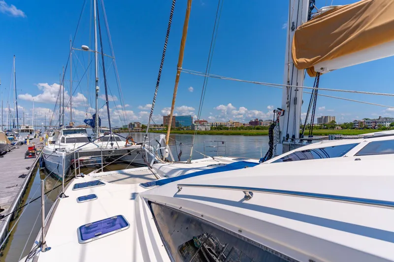 La Cura Yacht Photos Pics 2015 Privilege Series 5 yacht docked in sunny marina, clear blue sky.