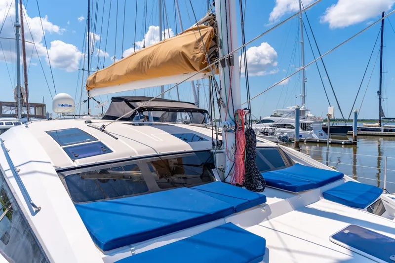 La Cura Yacht Photos Pics Luxury Privilege Series 5 yacht docked at marina, 2015 model, with blue cushions and sails.