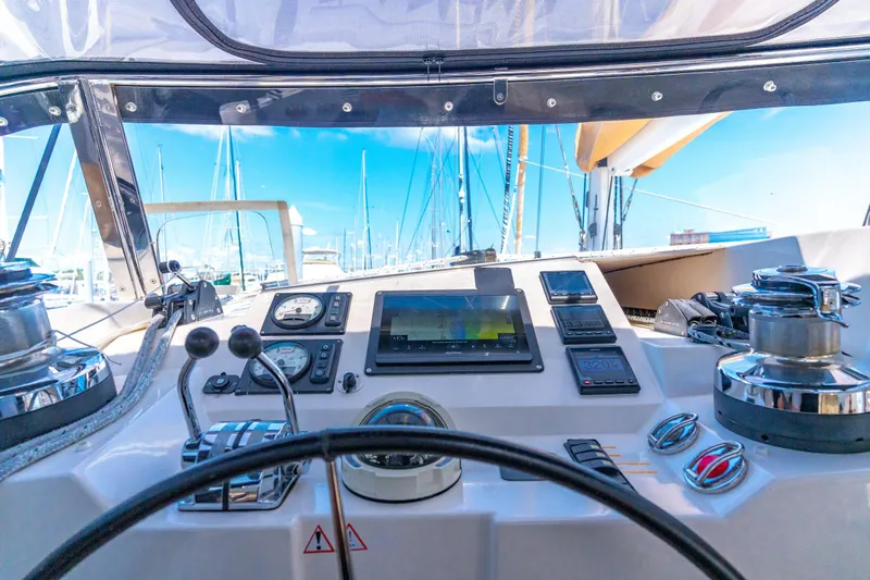 La Cura Yacht Photos Pics Cockpit view of 2015 Privilege Series 5 yacht with navigation instruments and steering wheel.