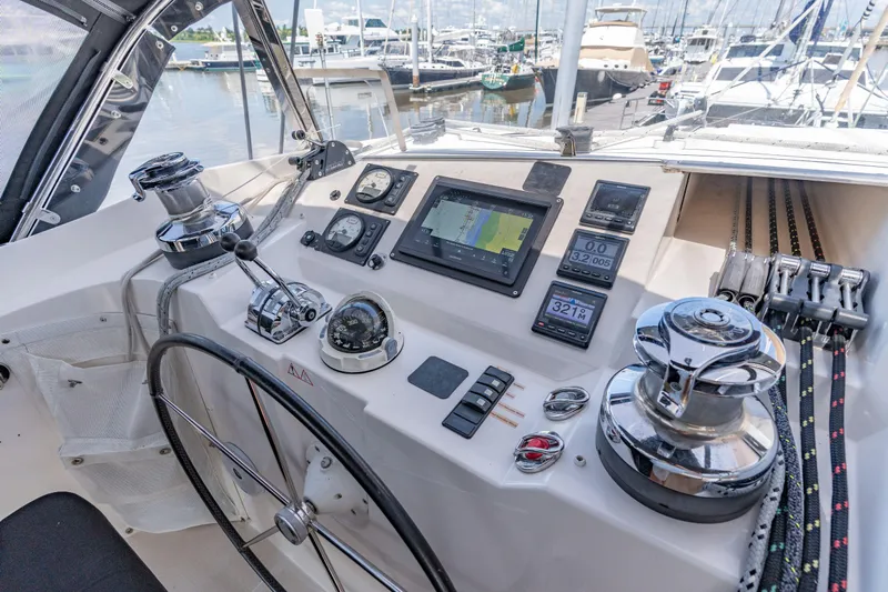 La Cura Yacht Photos Pics Cockpit of 2015 Privilege Series 5 yacht with navigation equipment and steering wheel.