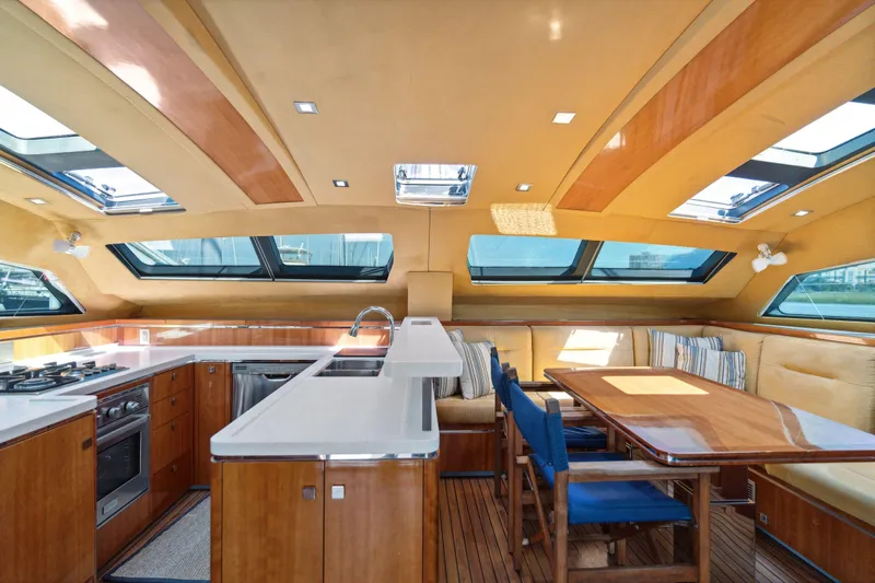 La Cura Yacht Photos Pics Luxurious 2015 Privilege Series 5 yacht interior with modern kitchen and dining area.