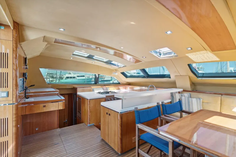 La Cura Yacht Photos Pics Luxurious 2015 Privilege Series 5 yacht interior with modern kitchen and dining area.
