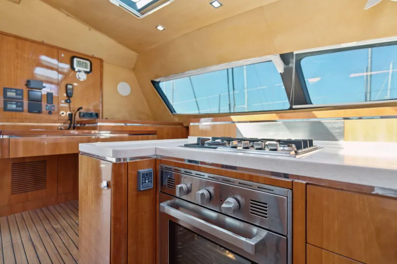 La Cura Yacht Photos Pics Luxury yacht kitchen interior, Privilege Series 5, 2015 model, featuring modern appliances and wood finish.