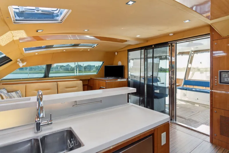 La Cura Yacht Photos Pics Luxurious interior of 2015 Privilege Series 5 yacht with modern kitchen and seating area.