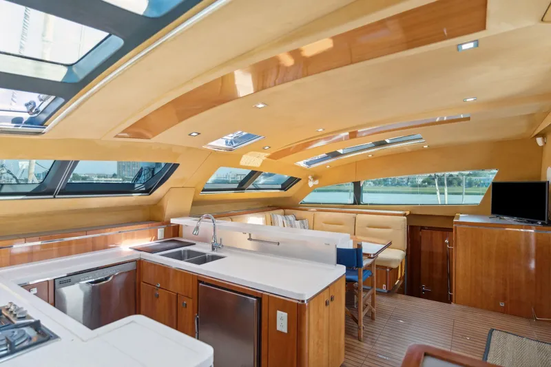 La Cura Yacht Photos Pics Luxurious 2015 Privilege Series 5 yacht interior with modern kitchen and dining area.