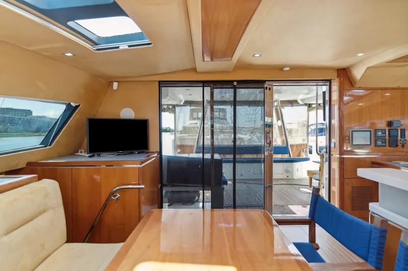 La Cura Yacht Photos Pics Luxurious 2015 Privilege Series 5 yacht interior with modern amenities and elegant wood finishes.