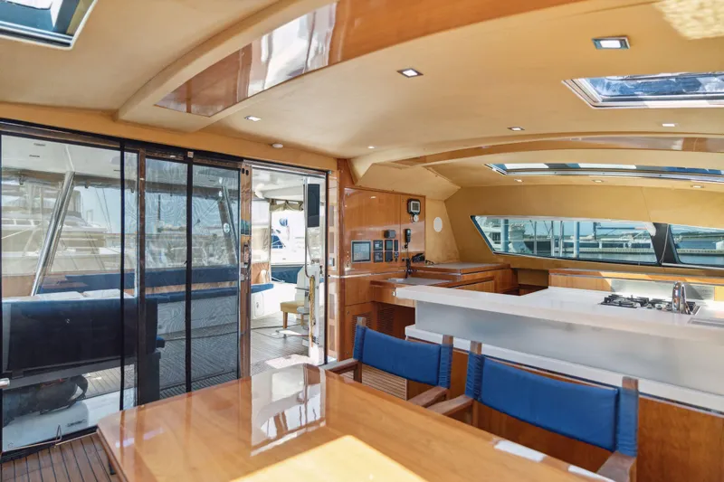 La Cura Yacht Photos Pics Luxurious 2015 Privilege Series 5 yacht interior with modern kitchen and dining area.