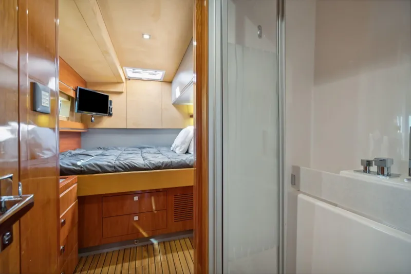 La Cura Yacht Photos Pics Luxury cabin interior of 2015 Privilege Series 5 yacht with bed and bathroom.