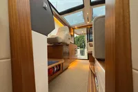 Interior of 2019 Nimbus 365 Coupe, featuring luxurious wood finishes and modern design elements.