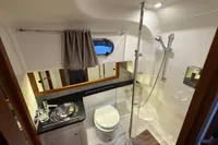Luxurious bathroom in 2019 Nimbus 365 Coupe yacht with shower and modern fixtures.