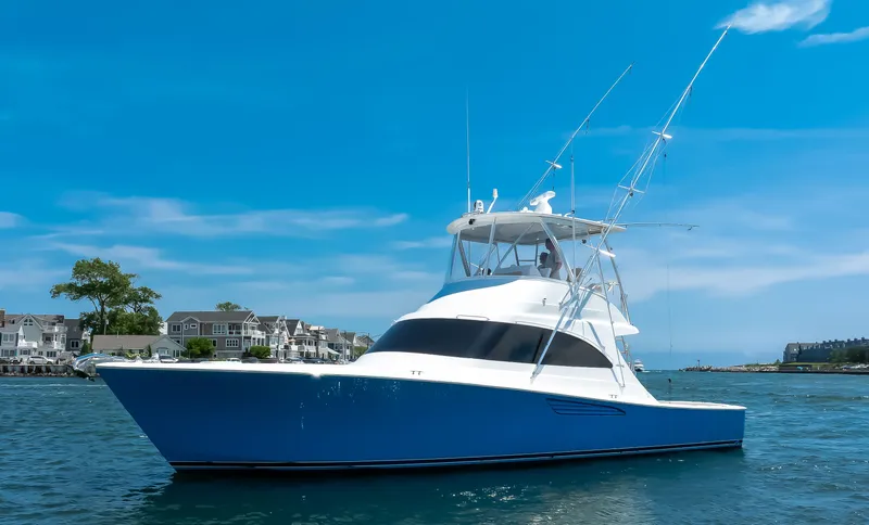 Stephanie Rose Yacht Photos Pics 2021 Viking 46 Billfish yacht on water, clear blue sky background.