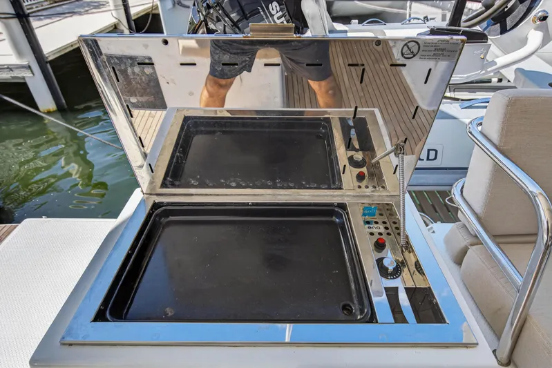 Lucky Dog Yacht Photos Pics Outdoor grill on 2022 Fountaine Pajot Tanna 47 yacht, featuring sleek stainless steel design.