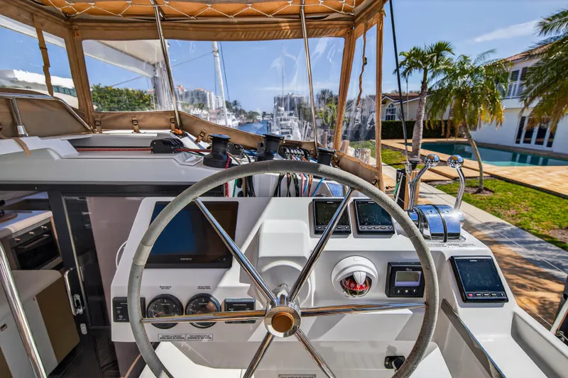 Lucky Dog Yacht Photos Pics Helm of 2022 Fountaine Pajot Tanna 47 catamaran with modern navigation equipment.