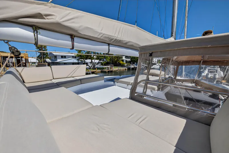 Lucky Dog Yacht Photos Pics 2022 Fountaine Pajot Tanna 47 yacht with spacious outdoor seating and clear skies.