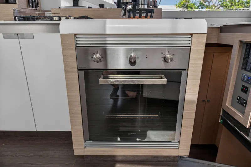 Lucky Dog Yacht Photos Pics Modern kitchen oven in 2022 Fountaine Pajot Tanna 47 yacht interior.