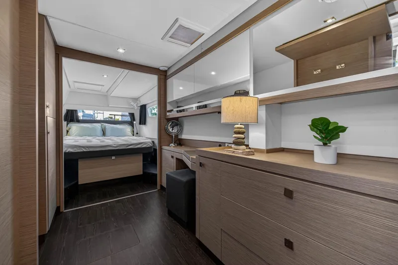 Lucky Dog Yacht Photos Pics Luxurious interior of 2022 Fountaine Pajot Tanna 47 yacht with modern bedroom and decor.
