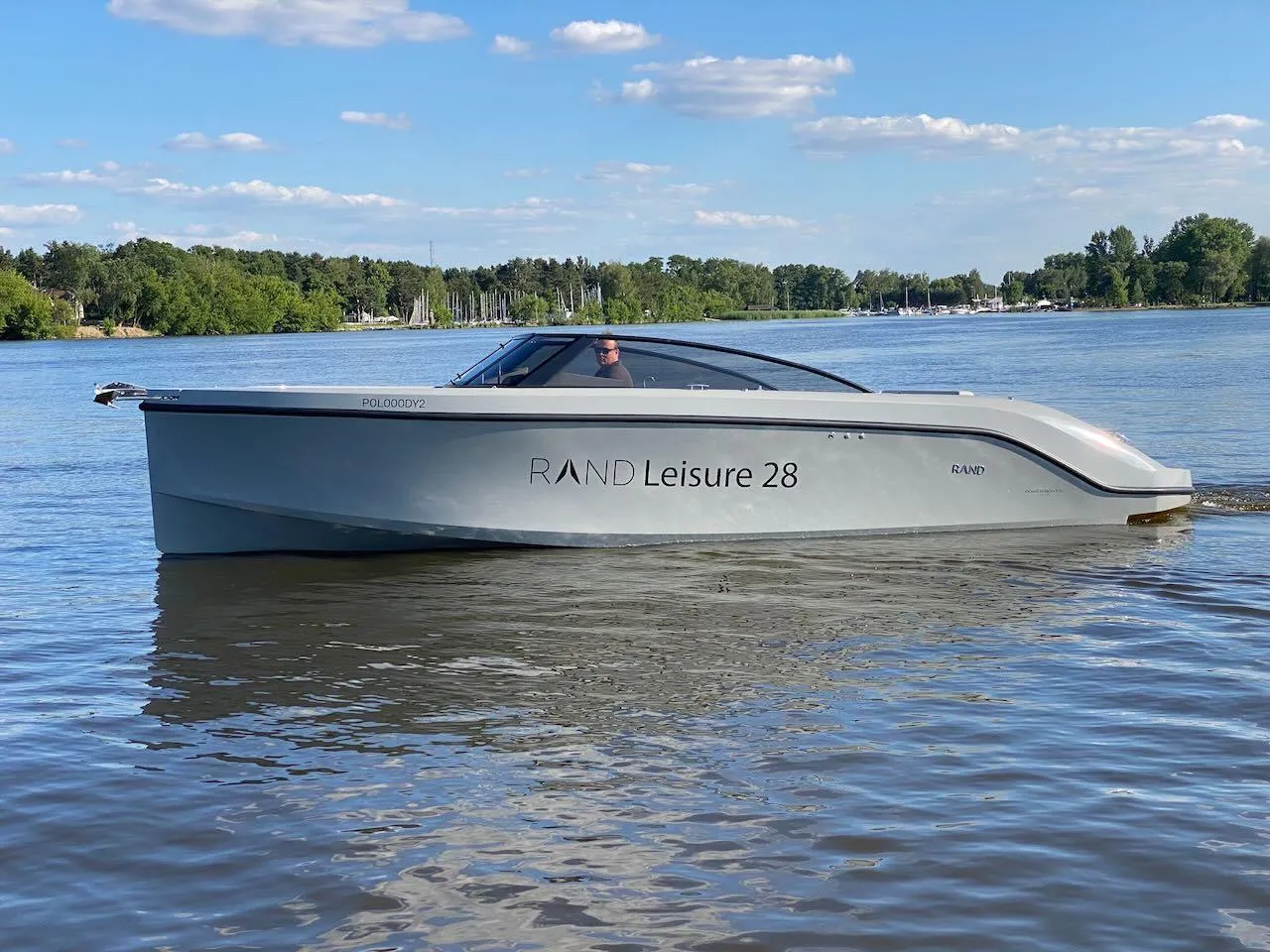 2021 Rand Leisure 28 boat cruising on a calm lake.