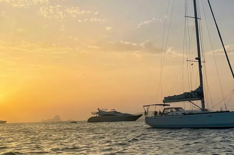  Yacht Photos Pics Sailboat X-Yachts X50 (2008) on serene sunset waters with distant yachts.