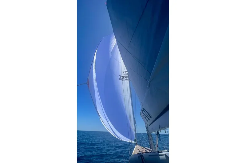  Yacht Photos Pics Sailing yacht X-Yachts X50 from 2008 with spinnaker on open sea.
