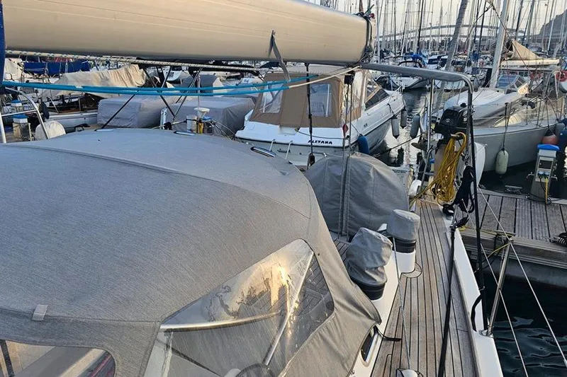  Yacht Photos Pics 2008 X-Yachts X50 sailboat docked in a marina, covered and ready for sailing.