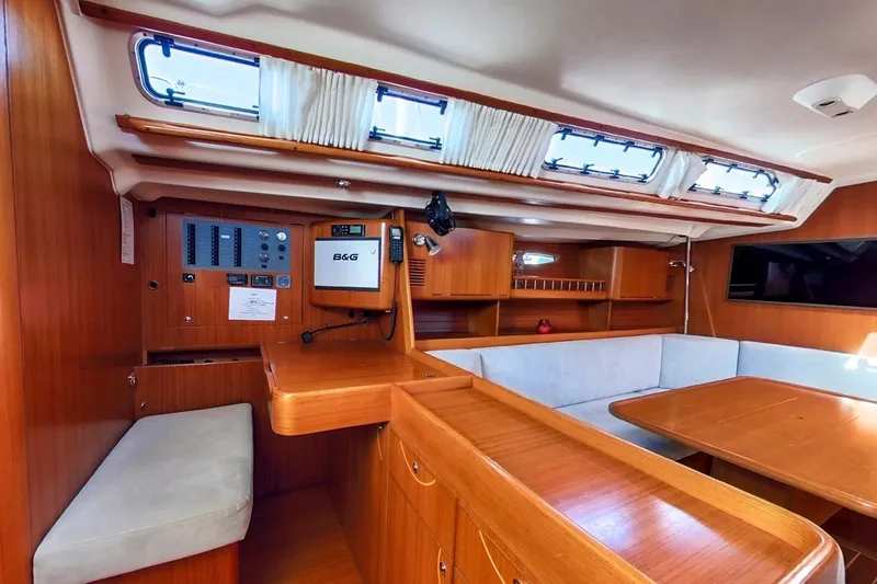  Yacht Photos Pics Interior of 2008 X-Yachts X50 sailboat with wood finish and navigation equipment.