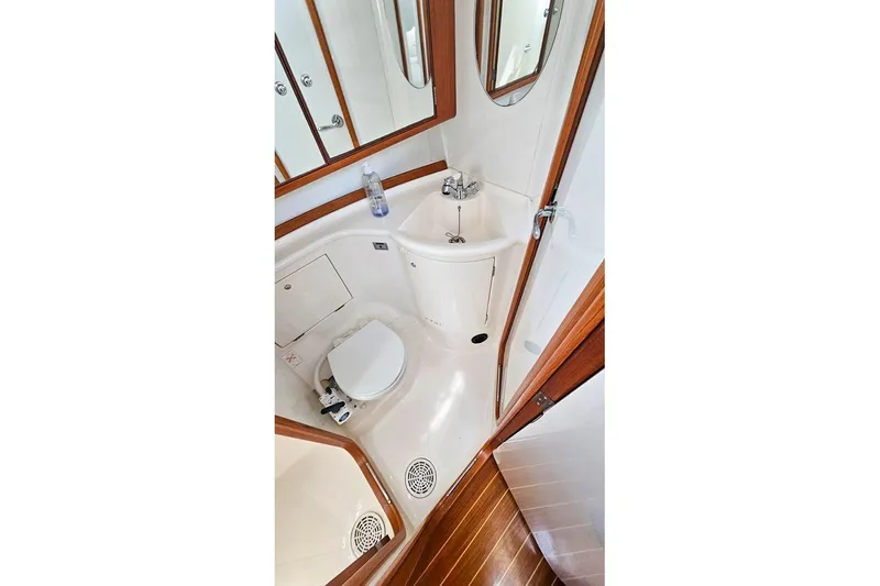  Yacht Photos Pics Compact bathroom in 2008 X-Yachts X50, featuring toilet, sink, and wooden accents.