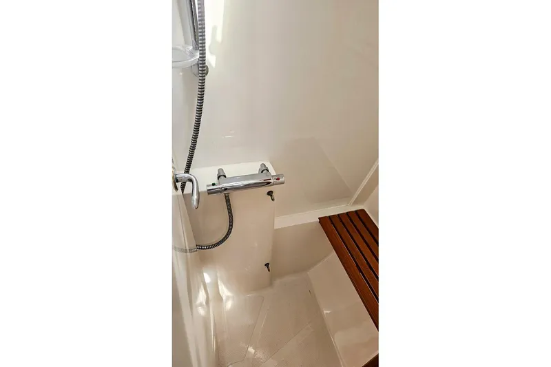  Yacht Photos Pics Shower area in 2008 X-Yachts X50, featuring sleek design and wooden seat.