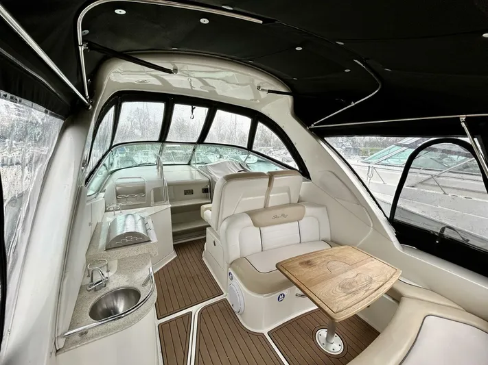  Yacht Photos Pics 2010 Sea Ray 330 Sundancer interior with seating, table, and helm.