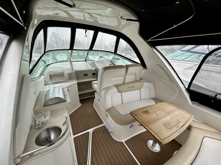  Yacht Photos Pics 2010 Sea Ray 330 Sundancer interior with seating, table, and kitchenette.