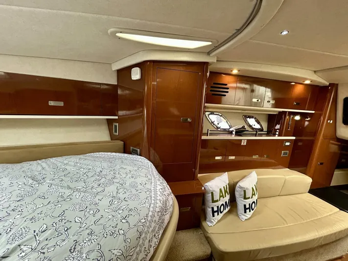  Yacht Photos Pics Interior of 2010 Sea Ray 330 Sundancer yacht with bed and seating area.
