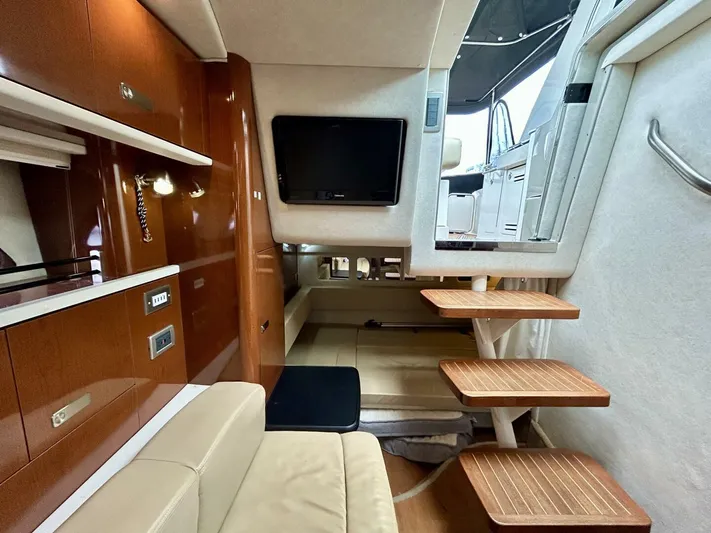  Yacht Photos Pics Interior of 2010 Sea Ray 330 Sundancer yacht with modern amenities and wooden accents.