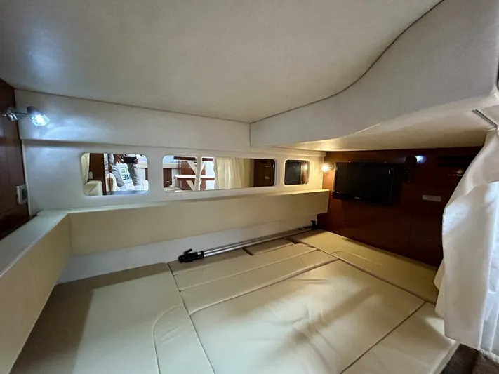  Yacht Photos Pics Interior cabin of 2010 Sea Ray 330 Sundancer, featuring cozy sleeping area and modern amenities.