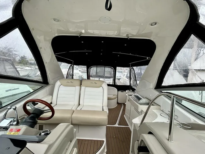  Yacht Photos Pics 2010 Sea Ray 330 Sundancer interior with plush seating and modern helm.