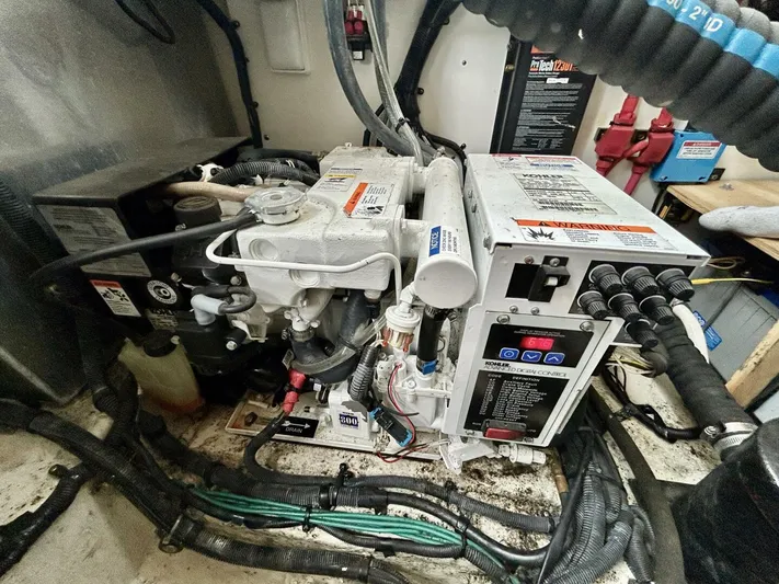  Yacht Photos Pics Engine room of 2010 Sea Ray 330 Sundancer with visible machinery and wiring.