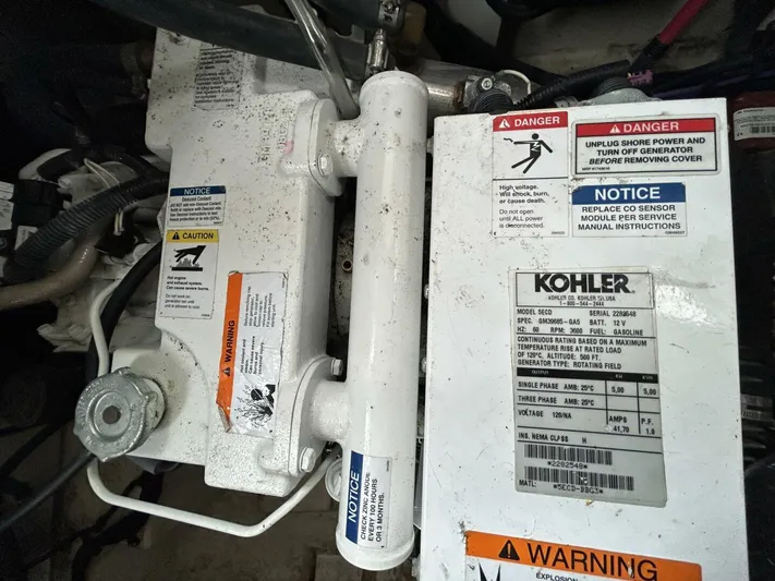  Yacht Photos Pics Kohler generator in a 2010 Sea Ray 330 Sundancer engine compartment with safety labels.