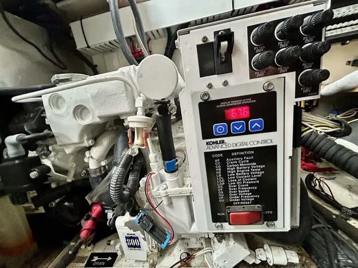  Yacht Photos Pics Engine control panel of a 2010 Sea Ray 330 Sundancer boat, featuring Kohler digital controls.