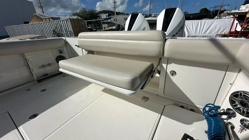  Yacht Photos Pics 2022 Boston Whaler 330 Outrage boat interior with foldable seating and twin engines.