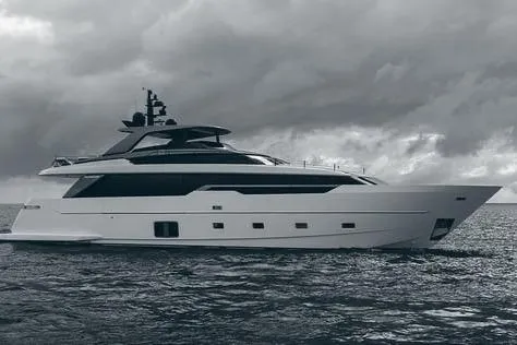  Yacht Photos Pics 2025 Sanlorenzo 96A yacht on open water under cloudy skies.