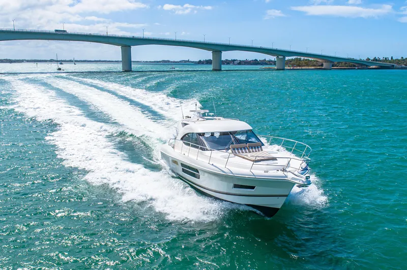 Belle-rosa Yacht Photos Pics 2016 Riviera 5000 Sport Yacht cruising under a bridge.