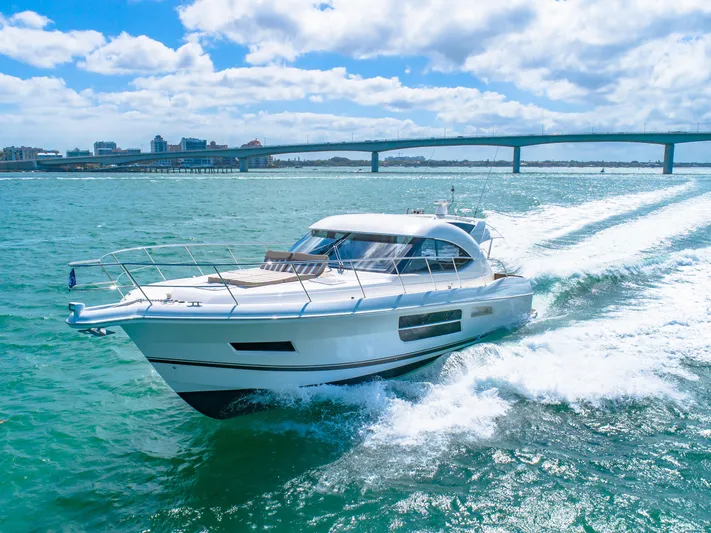 Belle-rosa Yacht Photos Pics 2016 Riviera 5000 Sport Yacht cruising under a bridge.