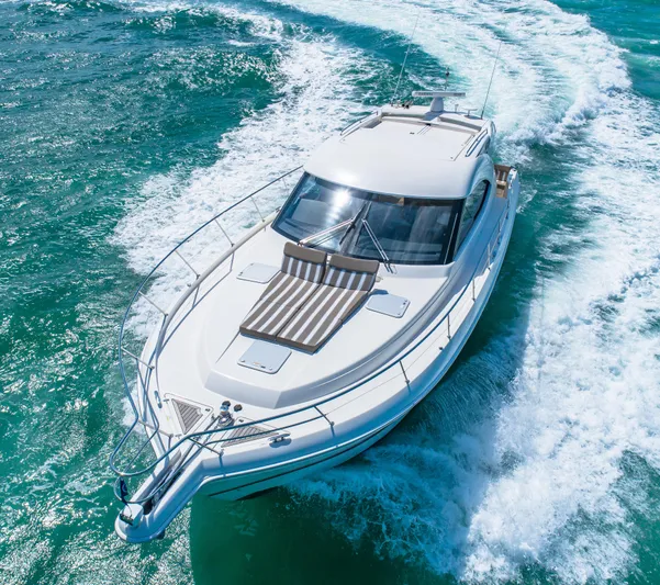 Belle-rosa Yacht Photos Pics 2016 Riviera 5000 Sport Yacht cruising on open sea.