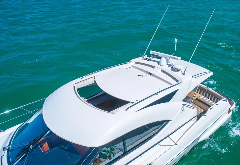 Belle-rosa Yacht Photos Pics 2016 Riviera 5000 Sport Yacht cruising on open sea.